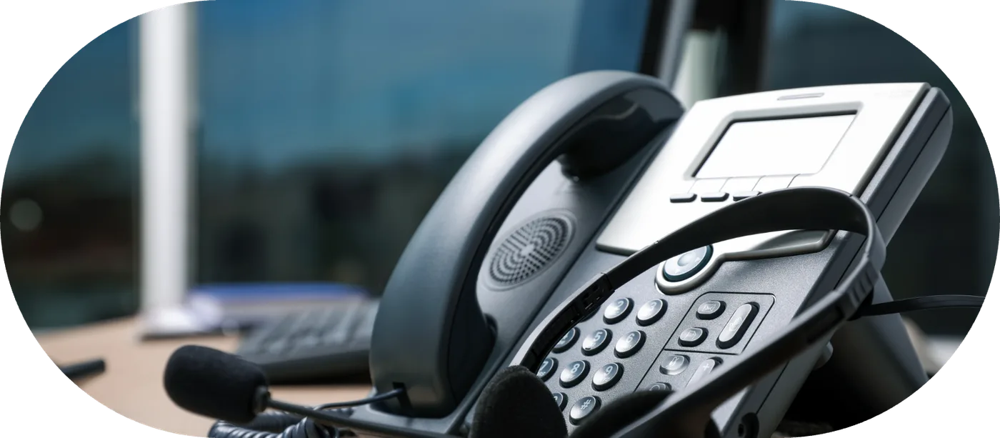 A desk phone on a working desk after a number transfer